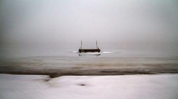 dock on wing lake beach in bloomfield hills michigan in winter